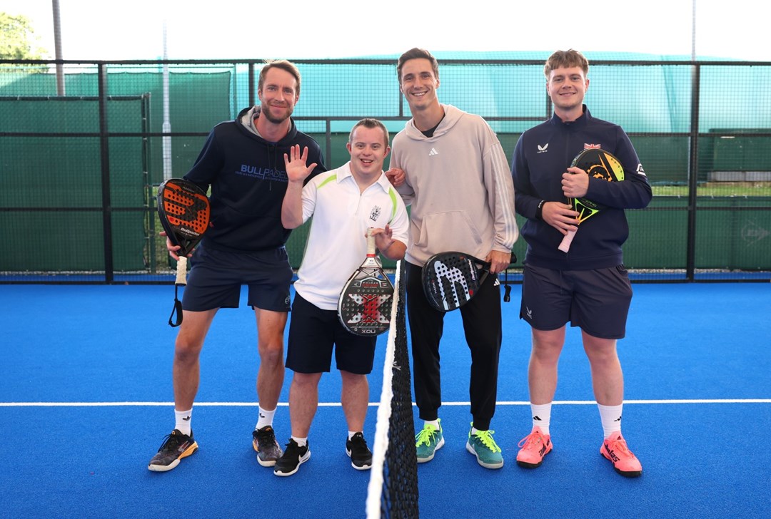 Joe and Chris Salisbury pose on the padel court with two young players