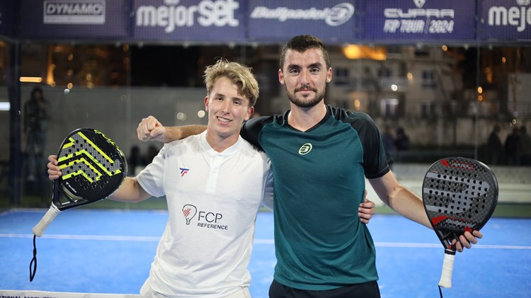 Christian Medina Murphy and Belar Vera Lopez pose on a padel court after winning title