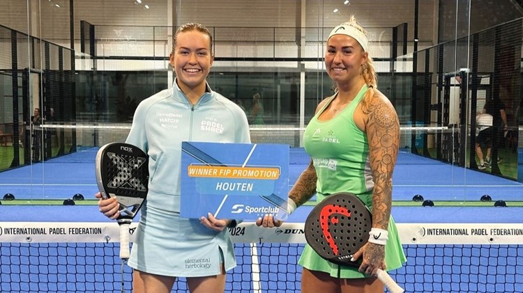 British padel player, Tia Norton, posing on court with her partner after winning the FIP Promotion Houten