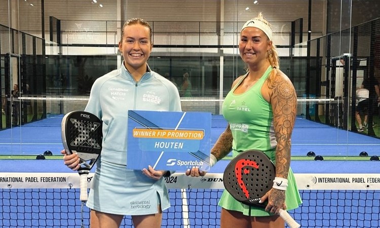 British padel player, Tia Norton, posing on court with her partner after winning the FIP Promotion Houten