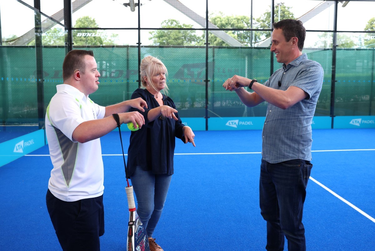 James chatting on the padel court