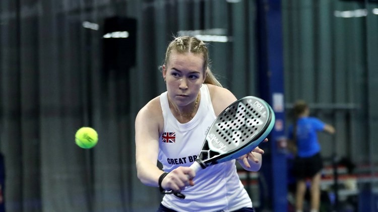 British padel player Tia Norton hitting a shot
