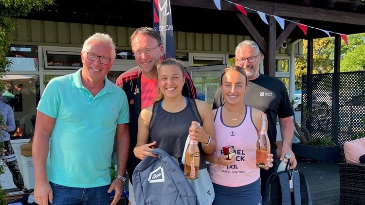 Aimee Gibson and Catherine Rose posing with their prizes at the Guernsey Padel Club