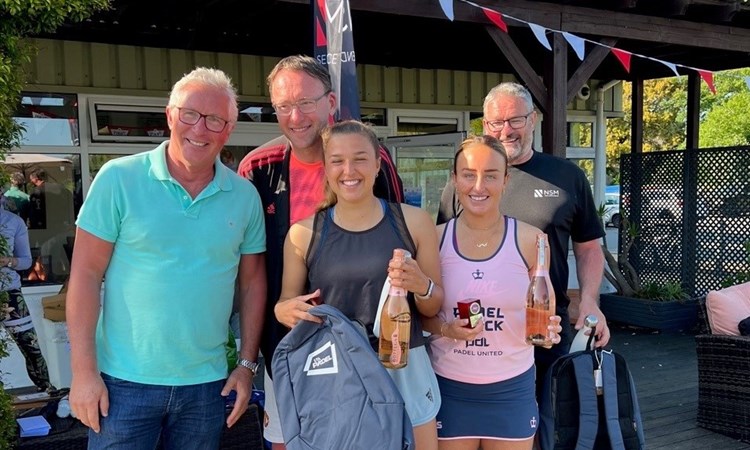 Aimee Gibson and Catherine Rose posing with their prizes at the Guernsey Padel Club