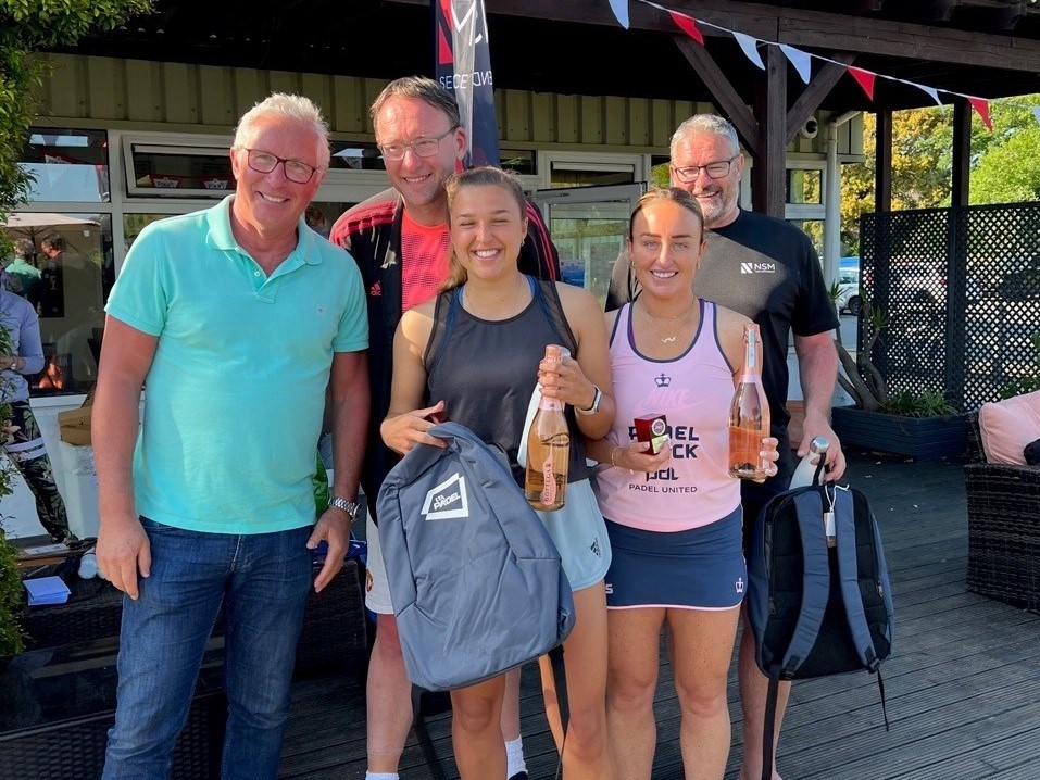 Aimee Gibson and Catherine Rose posing with their prizes at the Guernsey Padel Club