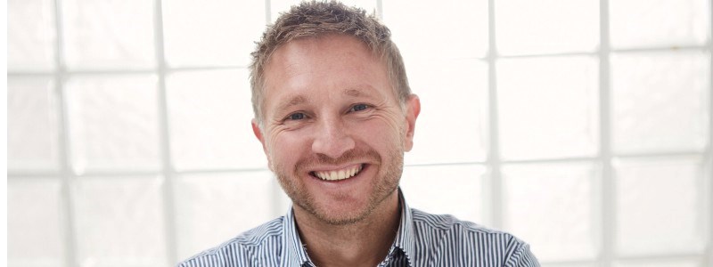 A headshot of Tom Murray, Head of Padel at the LTA