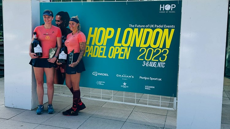 Players at the 2023 London Padel Open, posing in front of a tournament sign