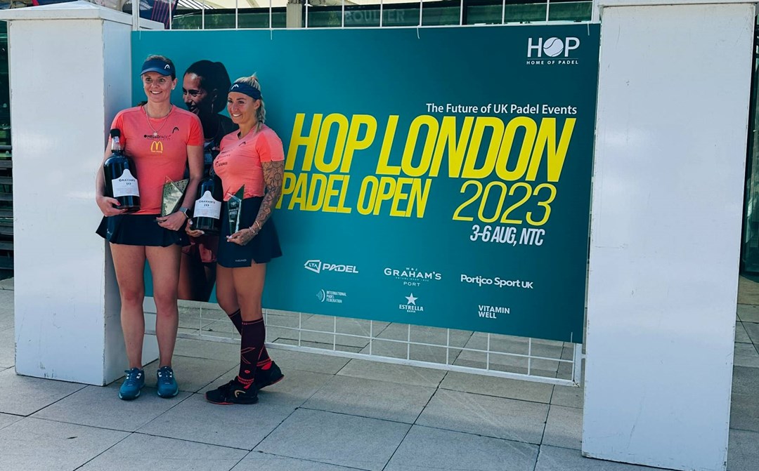 Players at the 2023 London Padel Open, posing in front of a tournament sign