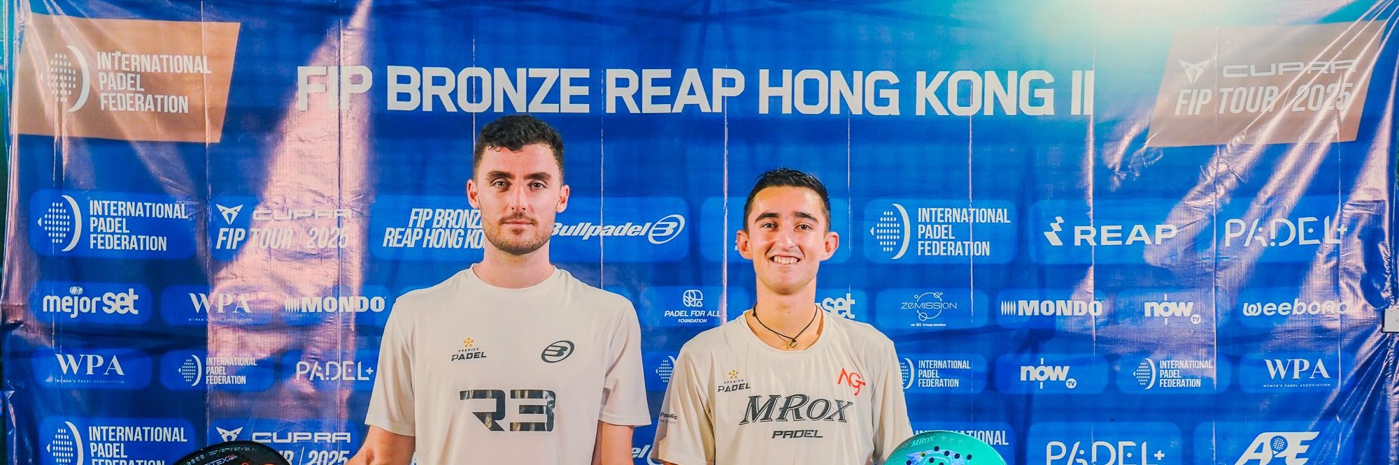 Christian Medina Murphy and Alberto Garcia Jimenez holding the FIP Bronze Hong Kong title