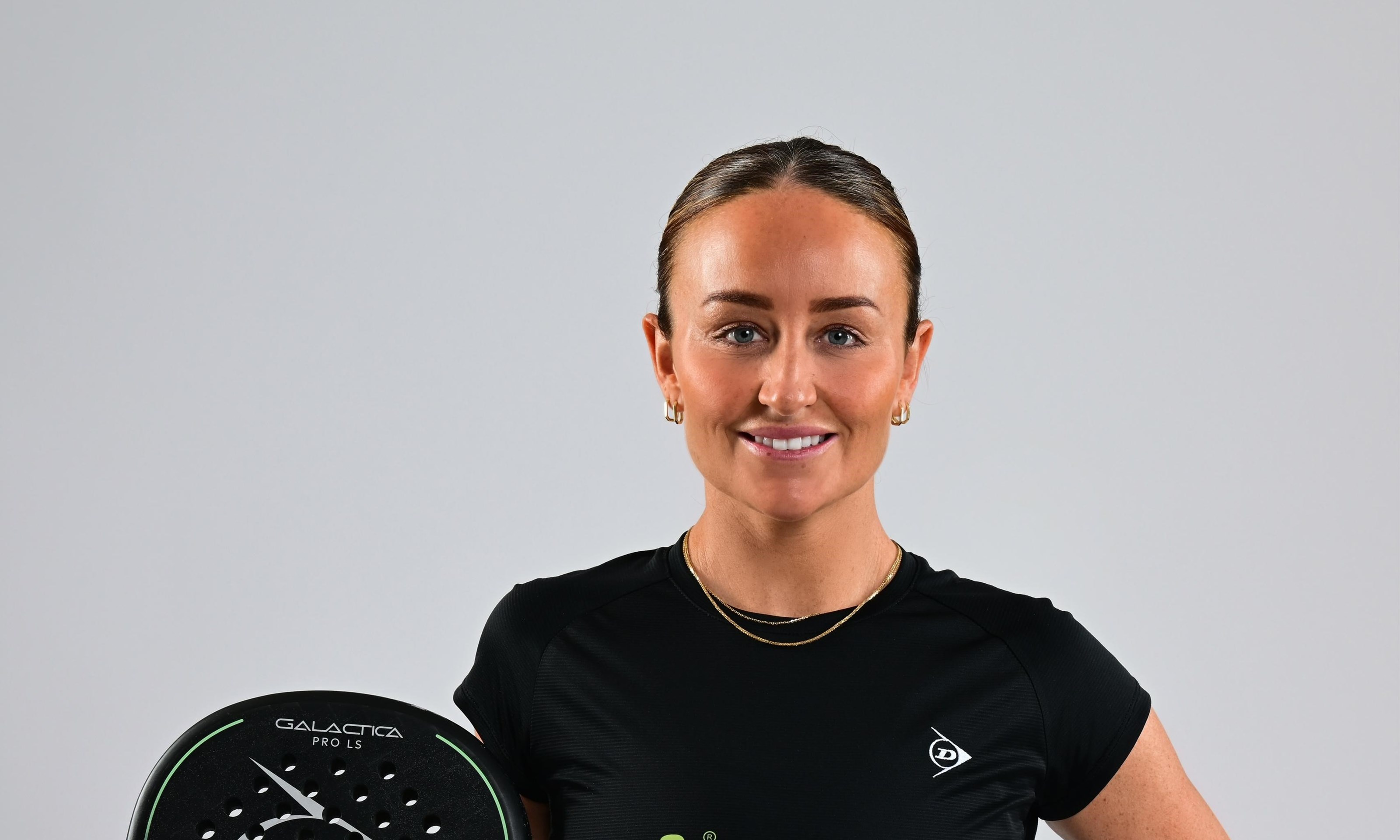 British padel player Aimee Gibson holding a racket