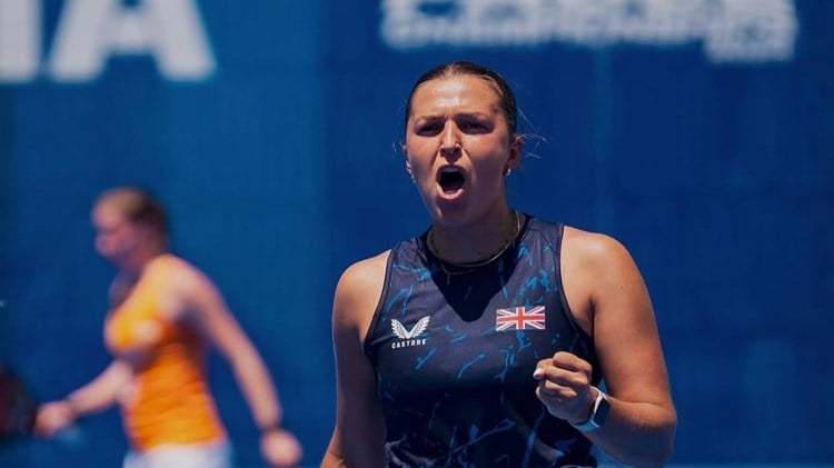 Catherine Rose cheering and pumping her fist in celebration on court
