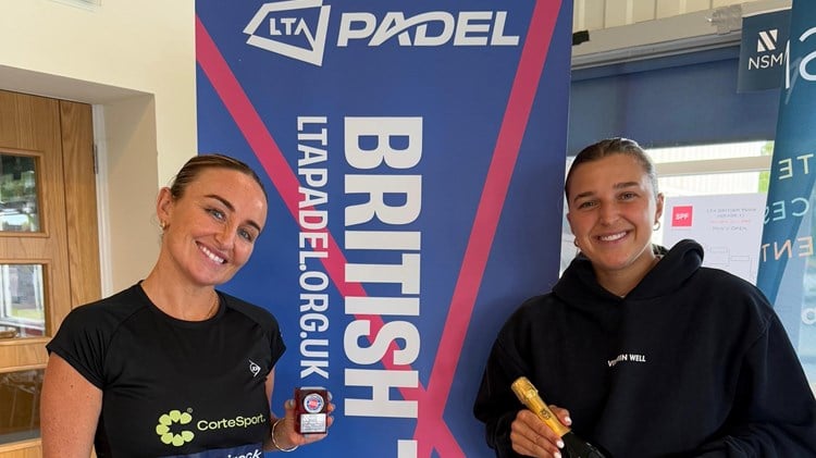 British No.1 Aimee Gibson and British No.2 Catherine Rose holding their trophies and a bottle of champagne after winning the LTA Padel British Tour tournament in Guernsey