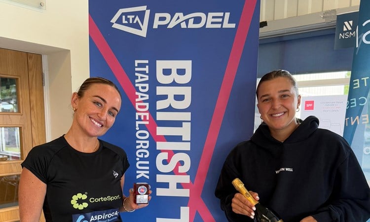 British No.1 Aimee Gibson and British No.2 Catherine Rose holding their trophies and a bottle of champagne after winning the LTA Padel British Tour tournament in Guernsey