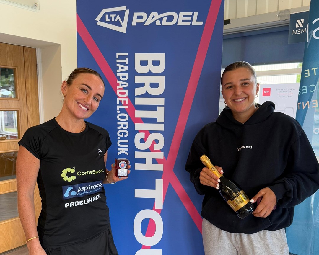 British No.1 Aimee Gibson and British No.2 Catherine Rose holding their trophies and a bottle of champagne after winning the LTA Padel British Tour tournament in Guernsey