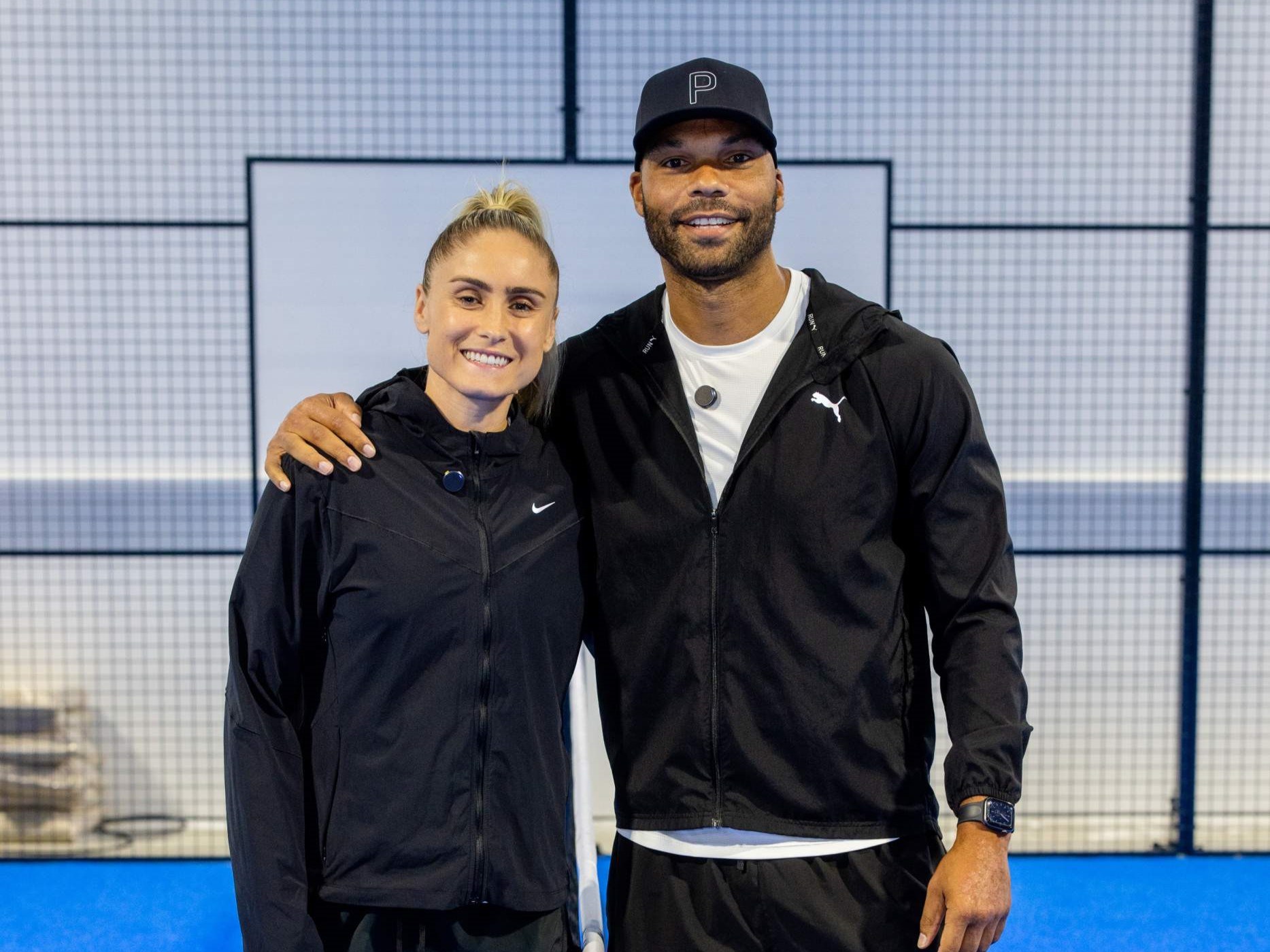 Former Lioness football player Steph Houghton MBE smiling on a padel court with Joleon Lescott at the Pro Am Padel Tour event at Pure Padel Stockport