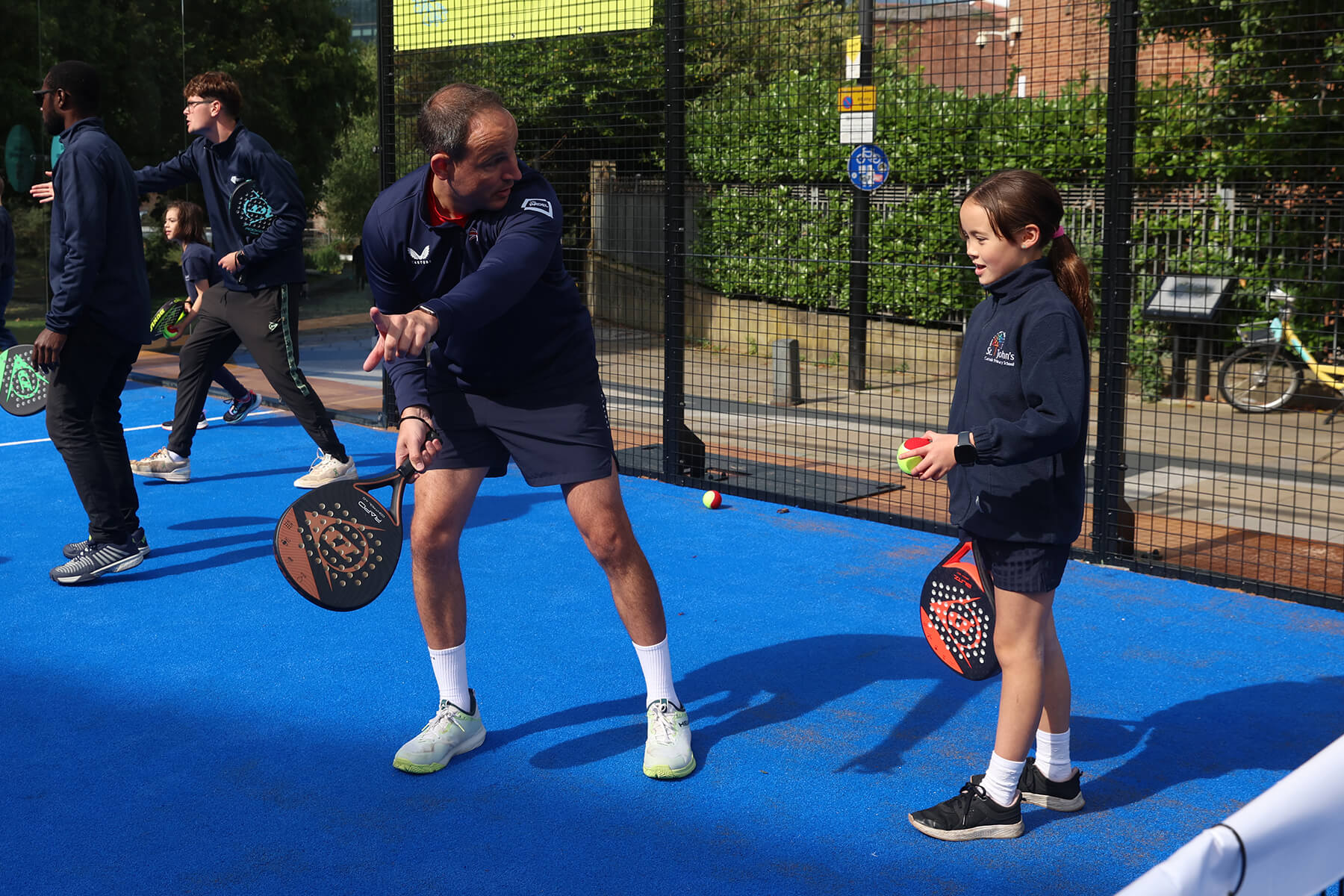 young-girl-with-padel-coach.jpg