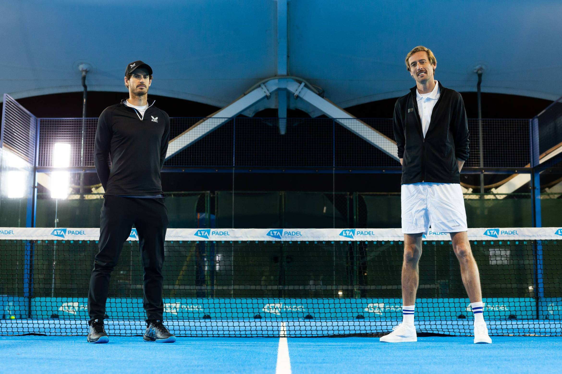 Andy Murray and Peter Crouch on court about to face off in a padel match for BBC's Children in Need