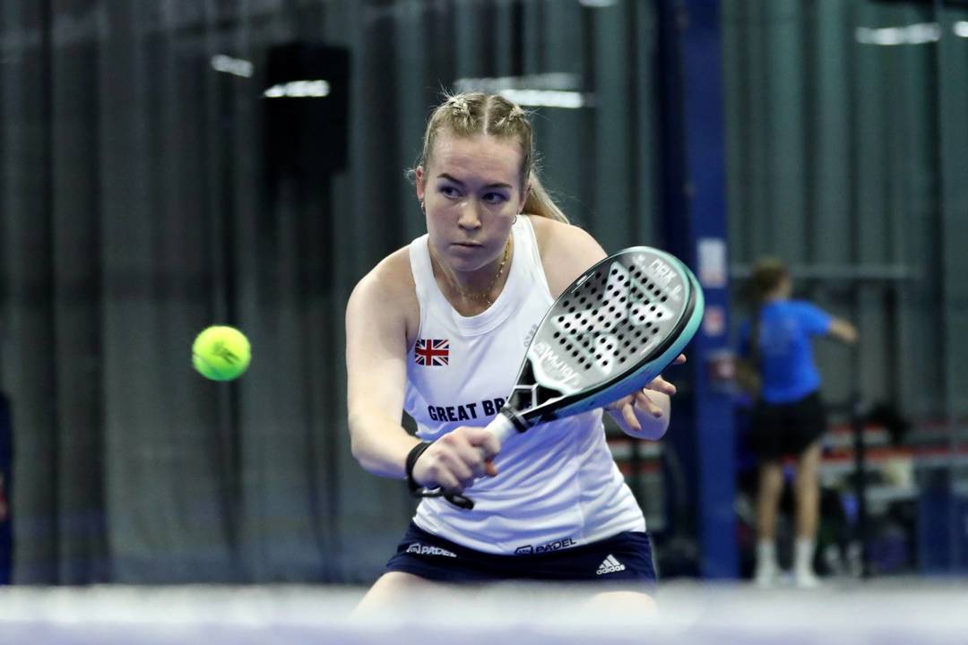 British padel player Tia Norton hitting a shot