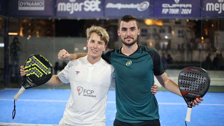 Christian Medina Murphy and Belar Vera Lopez pose on a padel court after winning title