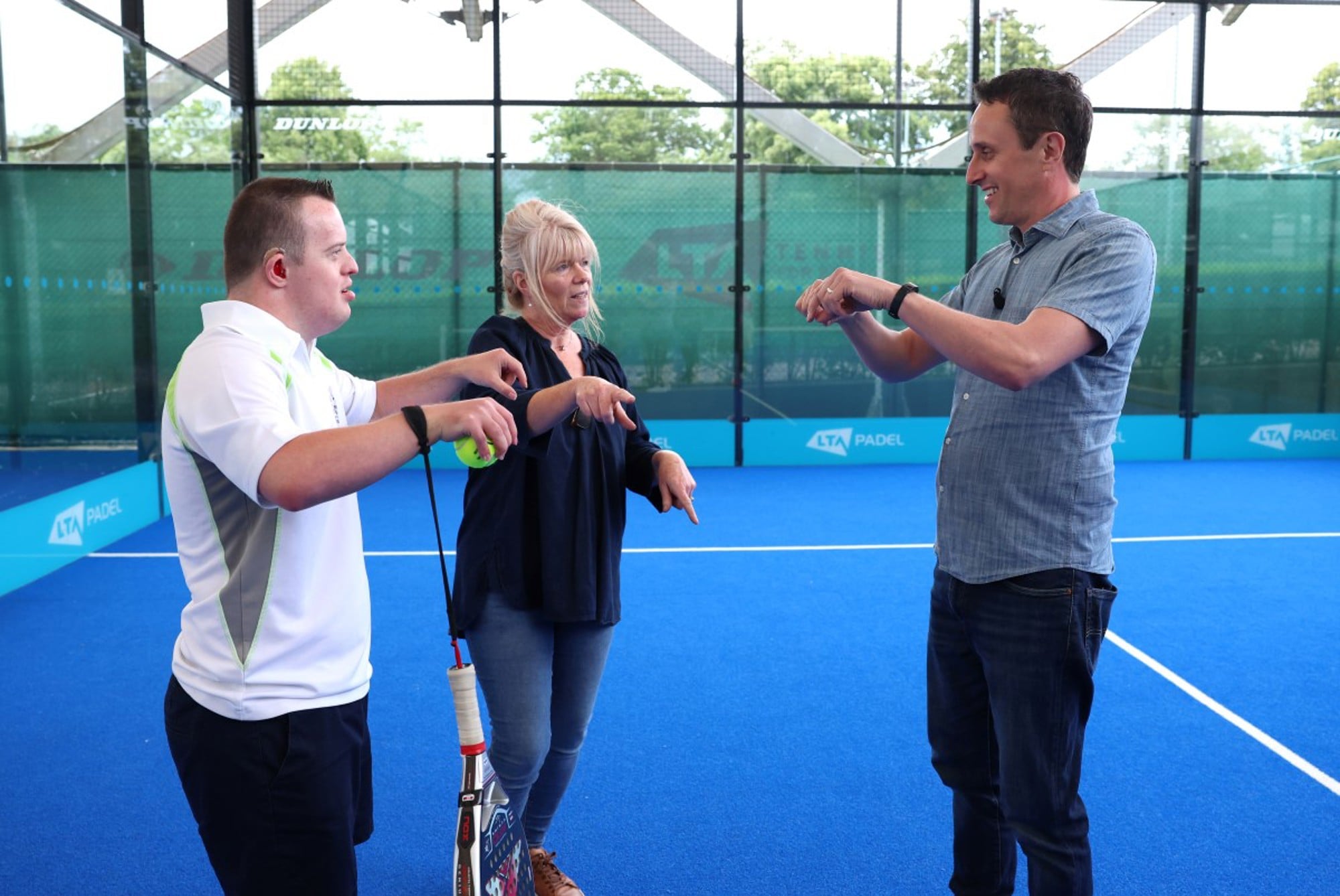 James chatting on the padel court