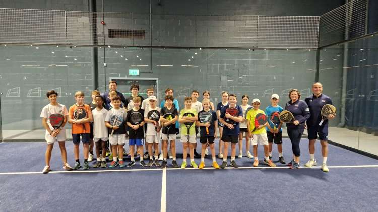 Libby Fletcher and Steve Yeardley stood on court with their junior padel players at the National Performance Junior Camps