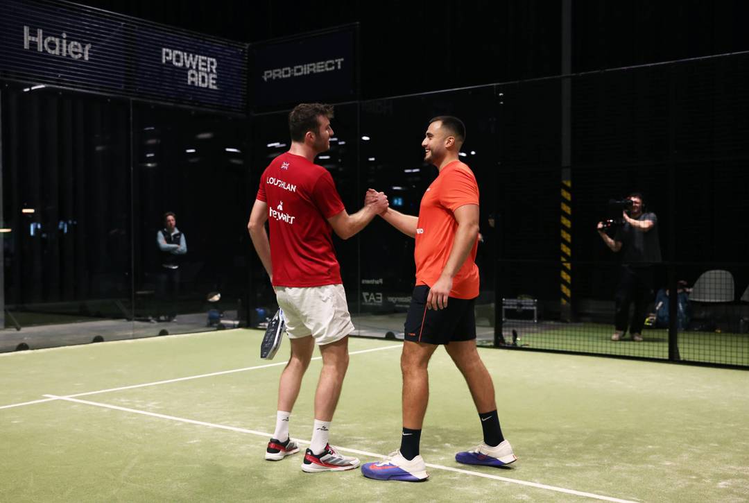 Alex Loughlan and Louie Harris high-five after winning the title at the LTA Padel National Championships