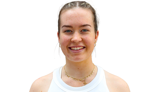 A front-on headshot of British padel player Tia Norton smiling